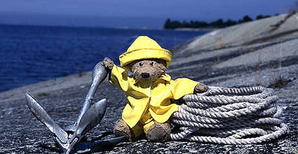 Yellow rain cap and hat on a Teddy Bear